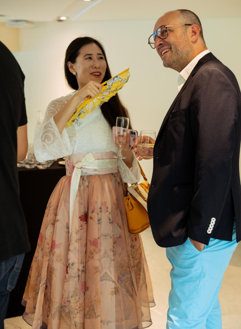 Guests in conversation at the Lounge